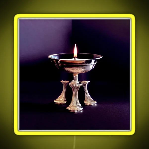 A Lit Candle In A Silver Bowl On A Table RGB Neon Sign