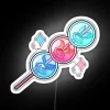 A vibrant, neon-lit glass dango decoration for gamers and artists