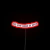 Vintage-inspired love quote illuminated in colorful, glowing neon letters