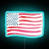 Vibrant American flag watercolor design in multicolored RGB neon lighting.