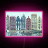 Amsterdam cityscape illuminated in vibrant RGB neon light details.