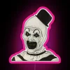 Vibrant neon lights illuminate eerie portrait of ART the Clown
