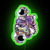 Whimsical astronaut and octopus abstract design with vibrant space colors.
