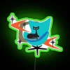 Vintage Neon Sign Featuring Feline Silhouette and Retro Inspired Chair