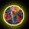 Vibrant outdoor autumn night scene with colorful circular neon pathway lighting.