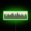 Neon sign featuring vibrant RGB colors in a scenic backdrop