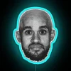 Vintage Neon Sign with Comedic Portrayal of Bald Derrick White