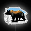 Cozy cabin decor with vibrant Bear in snowy mountain landscape