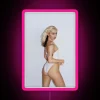 Eye-catching neon sign featuring vibrant colors and iconic portrait image.