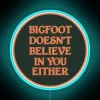 Glowing Neon Sign Humorously Challenges Beliefs with Bigfoot Skeptical Face