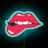 Softly glowing neon sign featuring a biting lip expression.