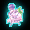 Add a quirky touch with vibrant Bitter and Strange neon lights.