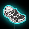 Elegant black cow silhouette with colorful crocodile details in neon
