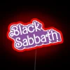 Electric purple glow of iconic heavy metal band's logo illuminated.