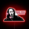 Spooky neon decor featuring Ghost Face's menacing 'Boo You Whore' phrase.