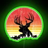 Buck deer silhouette in sunset hues with worn metallic finish