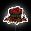 Autumn Harvest Neon Sign with Vibrant Red Apple Accents Glowing