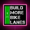 Vibrant RGB neon display promoting cycling infrastructure development and urban planning.