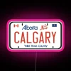 Personalized Calgary license plate frame with vibrant RGB neon lighting display