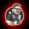 Vibrant Neon Sign Featuring Playful Caricature of James Wade's Face