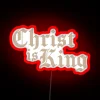 Neon wall art proclaiming Jesus Christ's sovereignty in vibrant colors.