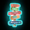 Vibrant tropical beach decor with colorful Coconut Girl direction RGB signs.
