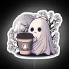 Whimsical neon sign featuring a coffee ghost under cherry blossoms