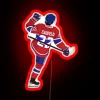 Celebrate your favorite player with this vibrant Cole Caufield sign