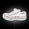 Vibrant neon sign featuring iconic converse logo in multicolor glow