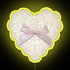 Whimsical LED sign with heart lace bow in neon colors.