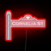 Vintage NYC streetscape nostalgia with colorful Cornelia Street sign lighting