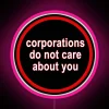 Corporate Disregard For Individuals Illuminated in Bold RGB Neon Letters