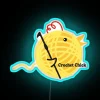 Colorful retro crochet enthusiast decor with humorous neon art lighting.