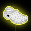 White crocs clog LED display neon sign with vibrant colors.