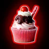 Vibrant Neon Sign Displaying Colorful Cupcake Illustration in Bold Letters
