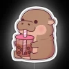 Adorable baby hippopotamus sips colorful boba tea under neon lights