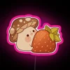 Mushroom friend enjoys vibrant strawberry night in glowing neon lights