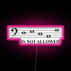 Bright musical decoration featuring neon bass clef design in RGB