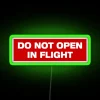 Neon Flight Safety Reminder Sign with Colorful Lettering Design