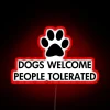 Neon welcome sign for dog lovers and their understanding friends.