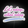 Neon Sign Artfully Depicting Free Love Without Makeup Requirements