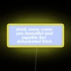 Motivational purple neon sign reminding self-care is essential for all.