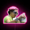 Glittering Eric Andre logo in bold red green neon lights