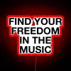 Vibrant RGB neon sign featuring lyrics that inspire freedom and joy.