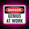 RGB neon warning light panel with humorous genius at work message