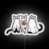 Spirited feline luminescence casts an eerie glow on Halloween nights