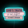 Neon sign featuring God's Truth in vibrant RGB colors