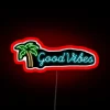 Bring tropical relaxation home with this vibrant neon palm sign.