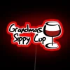 Neon grandmas sippy cup glow-in-the-dark barware sign, vintage fun drinkware.