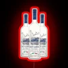 Quirky neon sign decor featuring Grey Goose vodka bottles humorously displayed